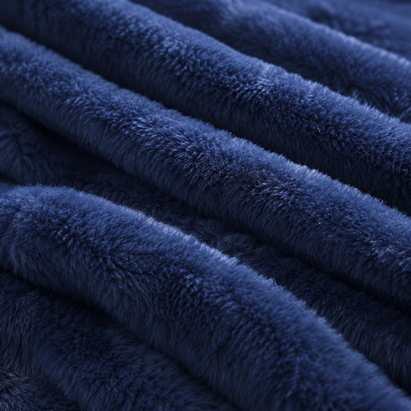 Detalhe da textura canelada plush macia da Manta Elegance